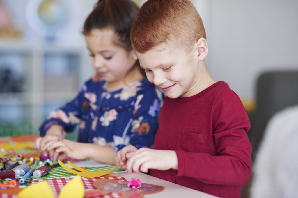 Two kids playing together at daycare in northwest calgary